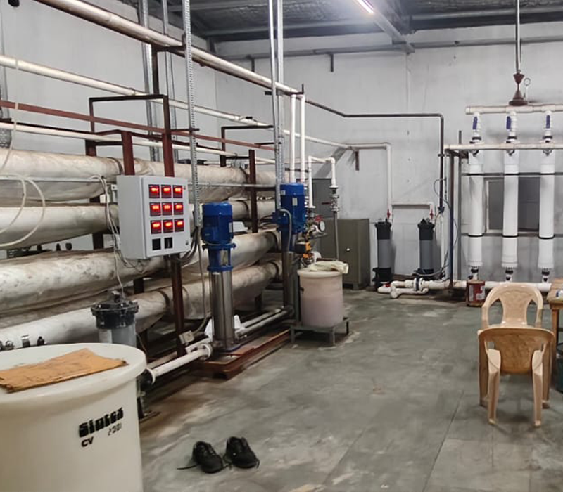 Industrial RO water plant with multi-stage filtration and control panel by Distingon Engineers & Consultant Pvt. Ltd.