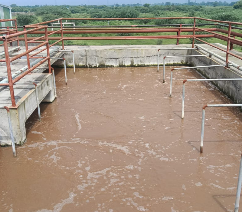 Active wastewater aeration tank with surface piping by Distingon Engineers & Consultant Pvt. Ltd.