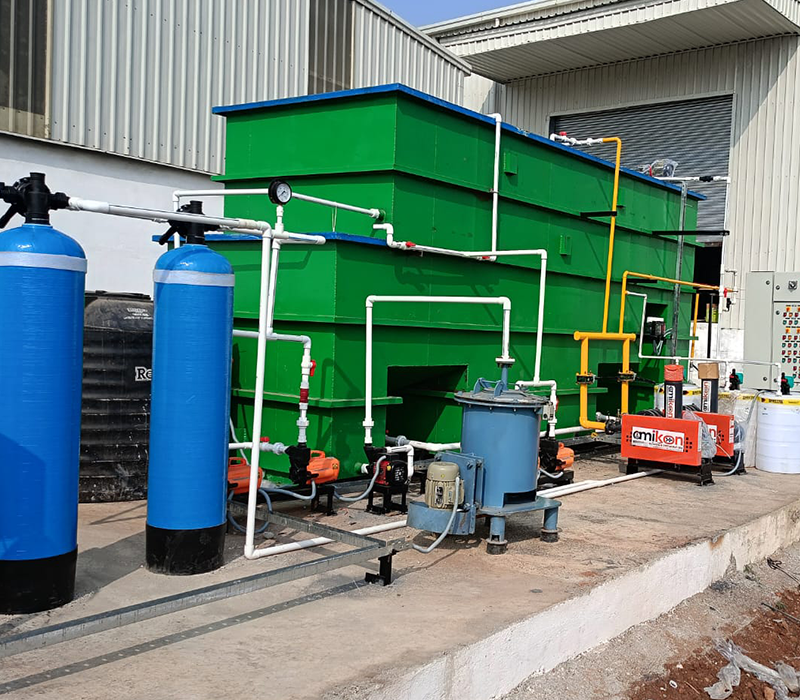 Compact industrial effluent treatment plant with green sedimentation tanks by Distington Engineers & Consultant Pvt. Ltd.
